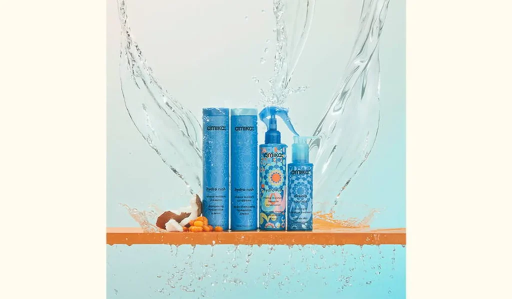  Amika Hydro Rush Intense Moisture Shampoo bottle with water droplets.