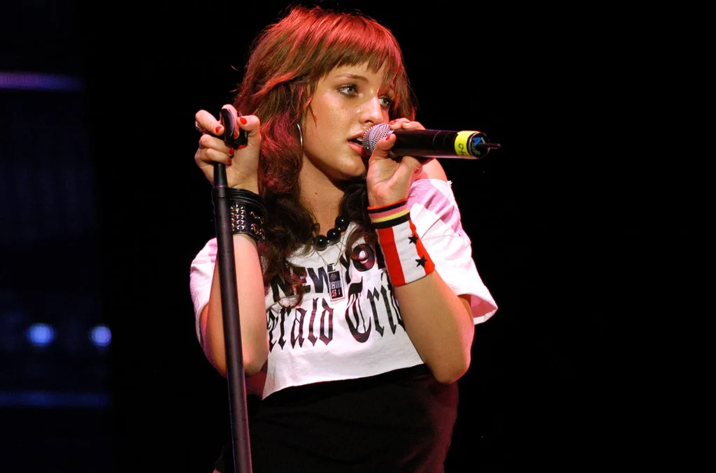 Ashlee Simpson Ross performing on stage during her early career.