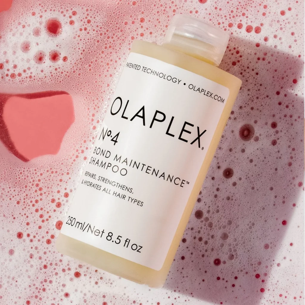 A bottle of Olaplex No. 4 Bond Maintenance Shampoo.