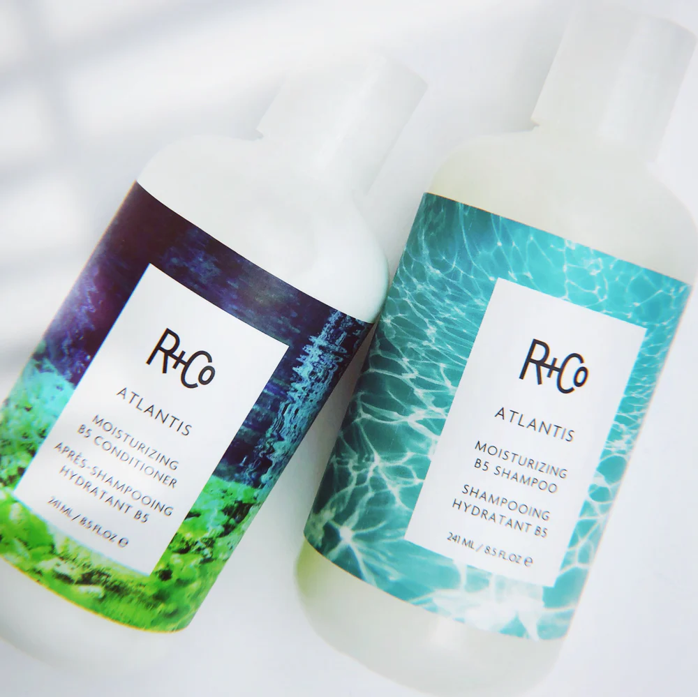 Two bottles of R+Co Atlantis Moisturizing B5 Shampoo.