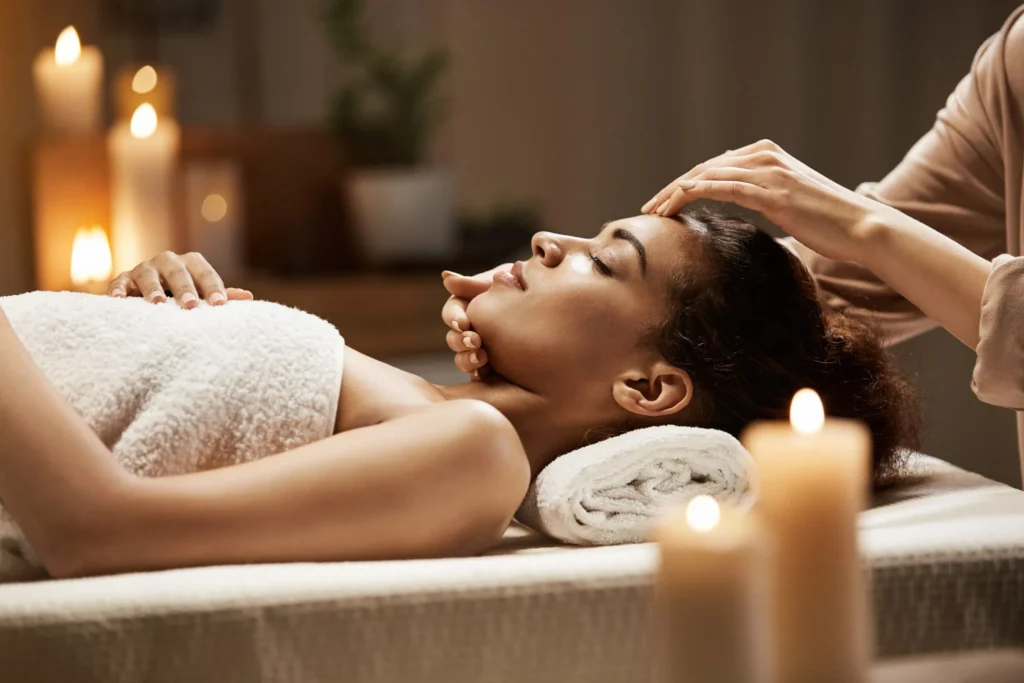 Woman getting a relaxing scalp massage at a salon.