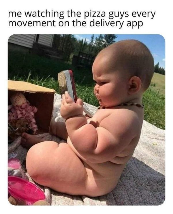 A funny image of a baby intently tracking a pizza delivery on a phone.