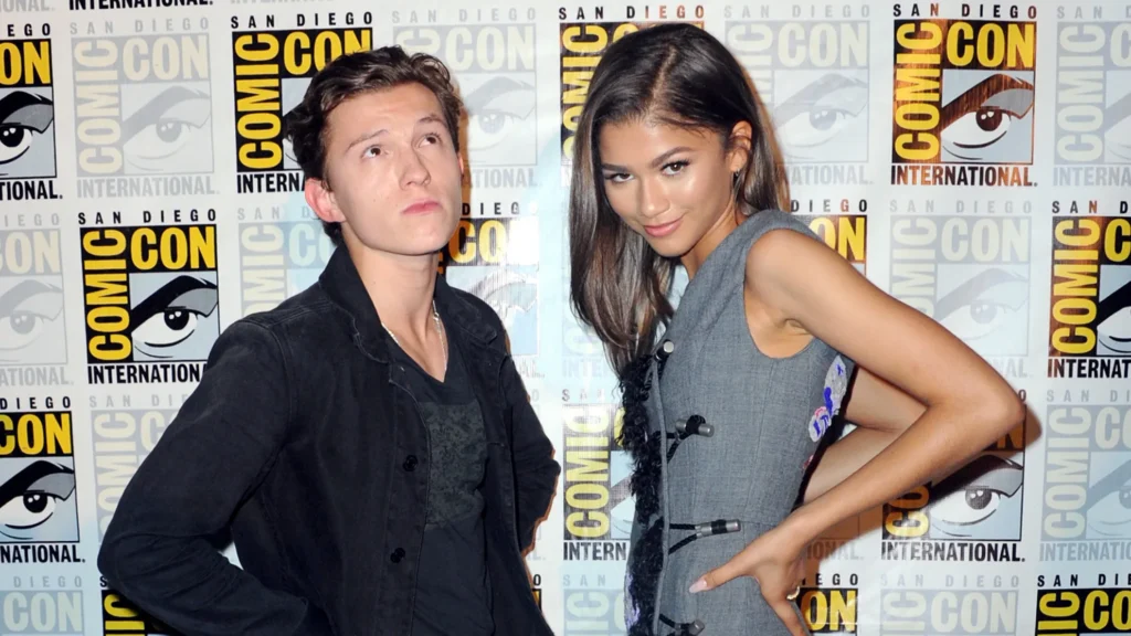 Tom Holland and Zendaya interacting playfully at San Diego Comic-Con.