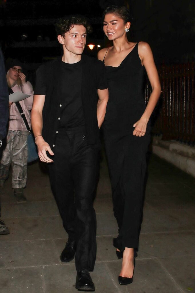 Tom Holland and Zendaya holding hands after the Dune: Part Two premiere.