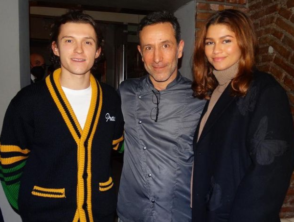 Tom Holland and Zendaya posing with chef Francesco Panella at Antica Pesa in Rome.