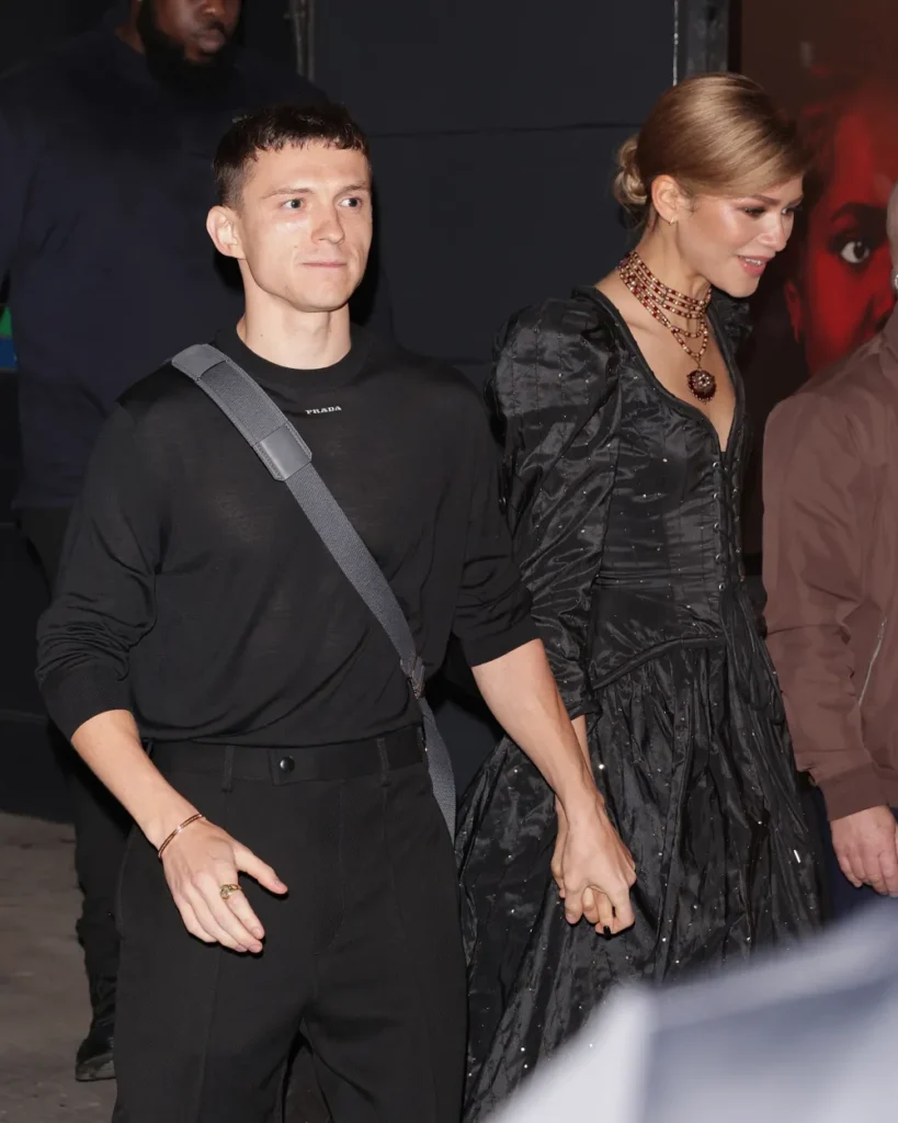 Tom Holland and Zendaya holding hands after a performance of Romeo and Juliet in London.