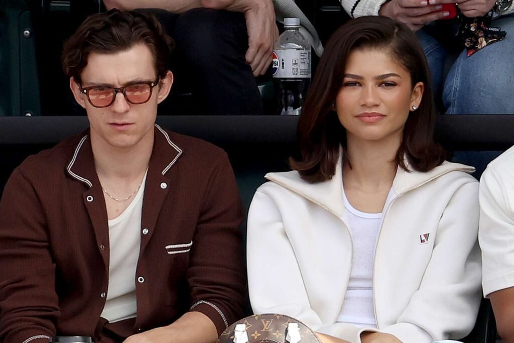 Tom Holland and Zendaya watching a tennis match together at the BNP Paribas Open.